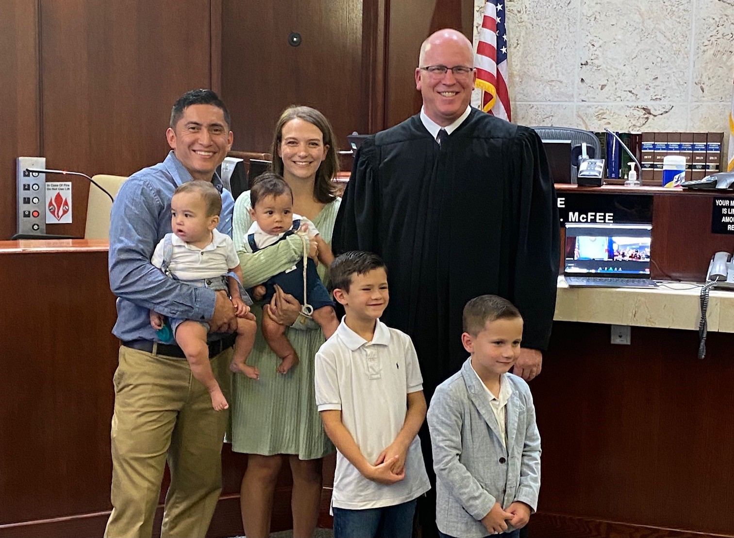 Judge Shannon McFee pictured with a family in Collier County